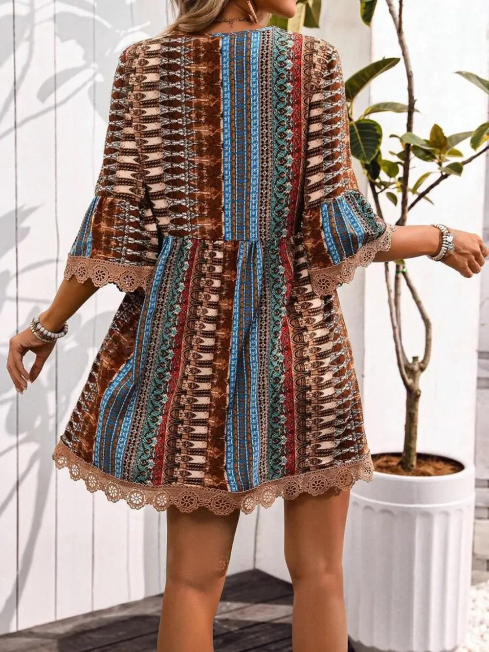 Rust boho print V-neck mini dress with lace trim