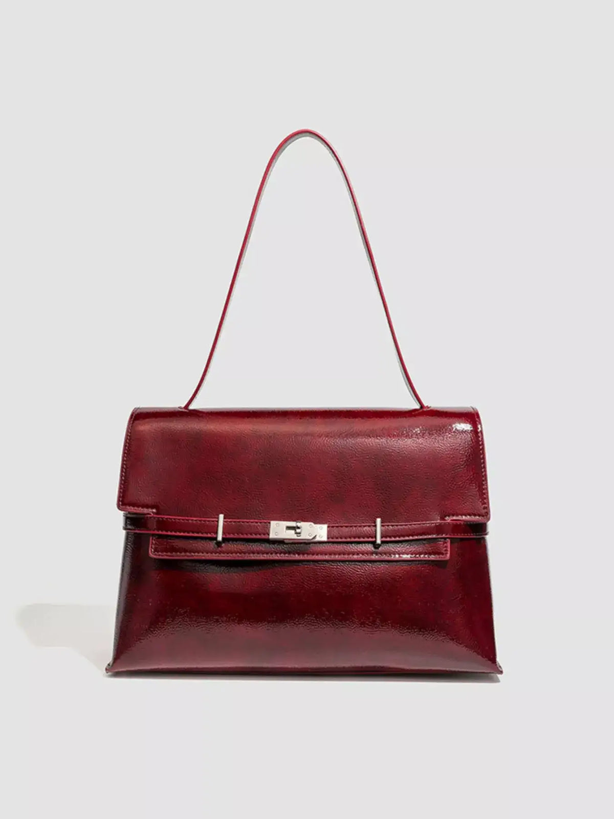 Burgundy medium PU leather buckle shoulder bag with a sleek, polished finish