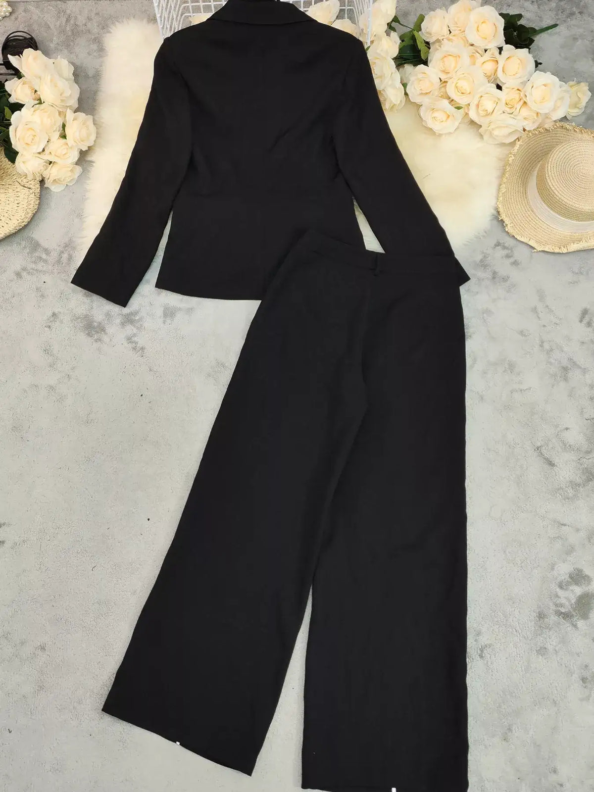 Black Evie's Dreamland two-piece suit featuring a tailored blazer and wide leg pants.