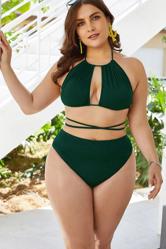 Plus size backless halter bikini set styled for a summer beach day.