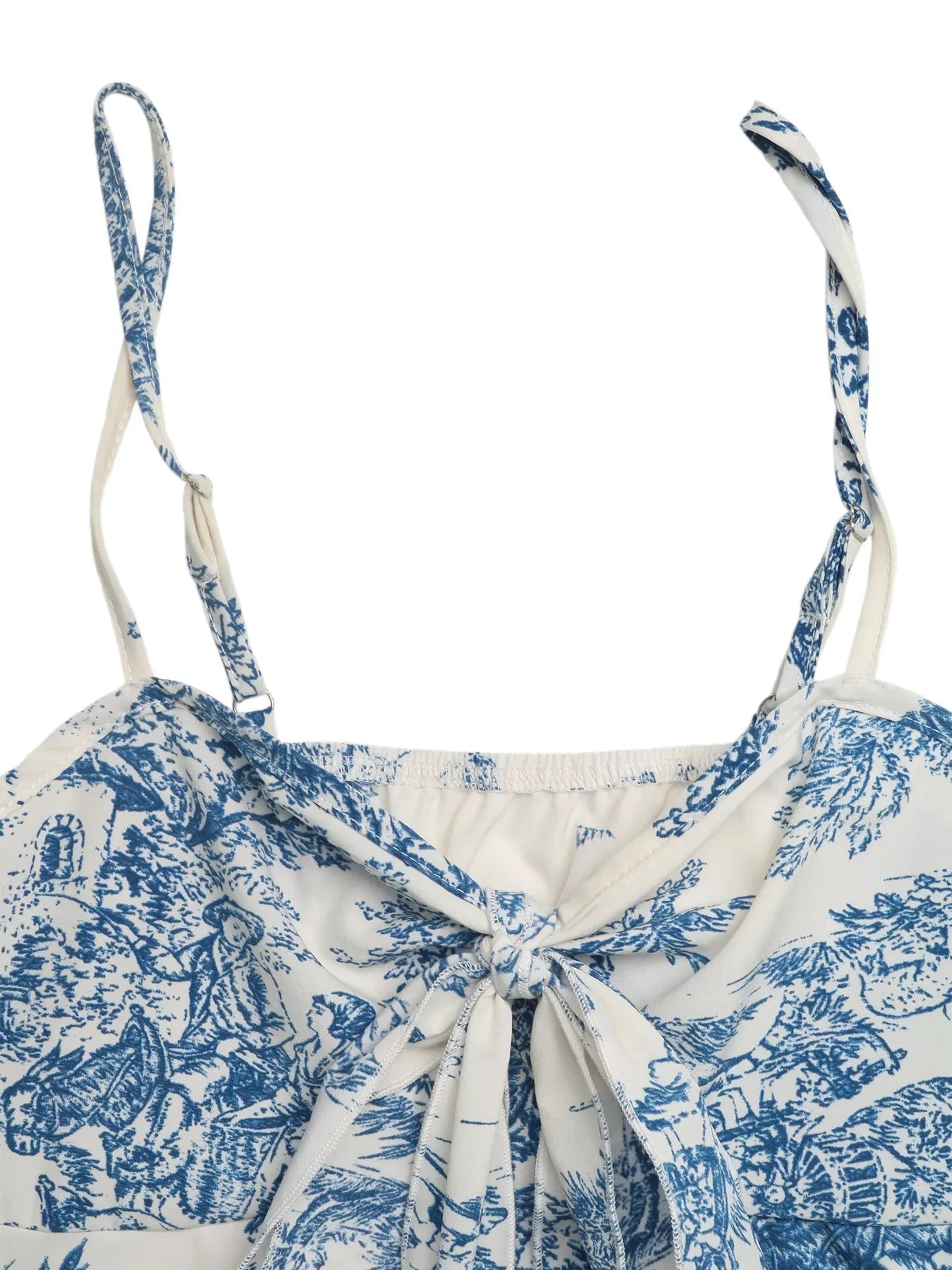 Woman wearing a blue floral tie-front summer cami top