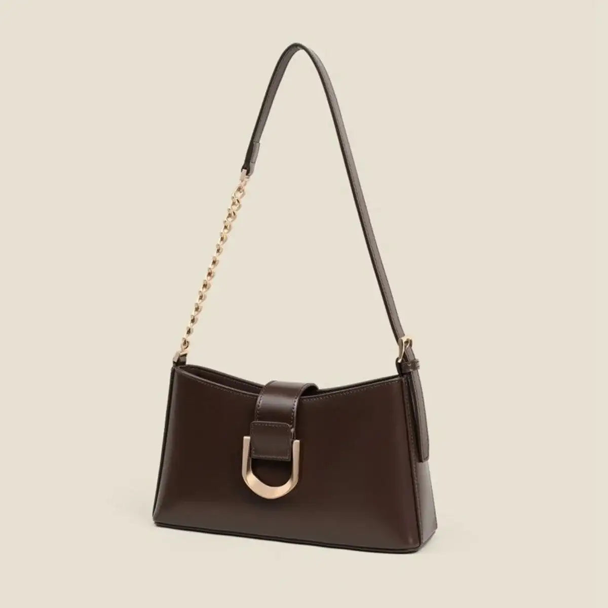 Evie's Dreamland small dark brown PU leather shoulder bag with gold chain strap and metal buckle detail.