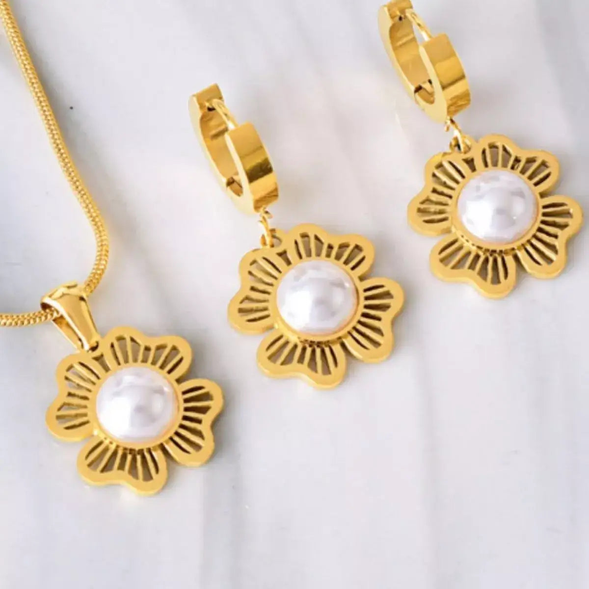 Evie's Dreamland 18K gold-plated flower and pearl jewelry set featuring a necklace and matching earrings.