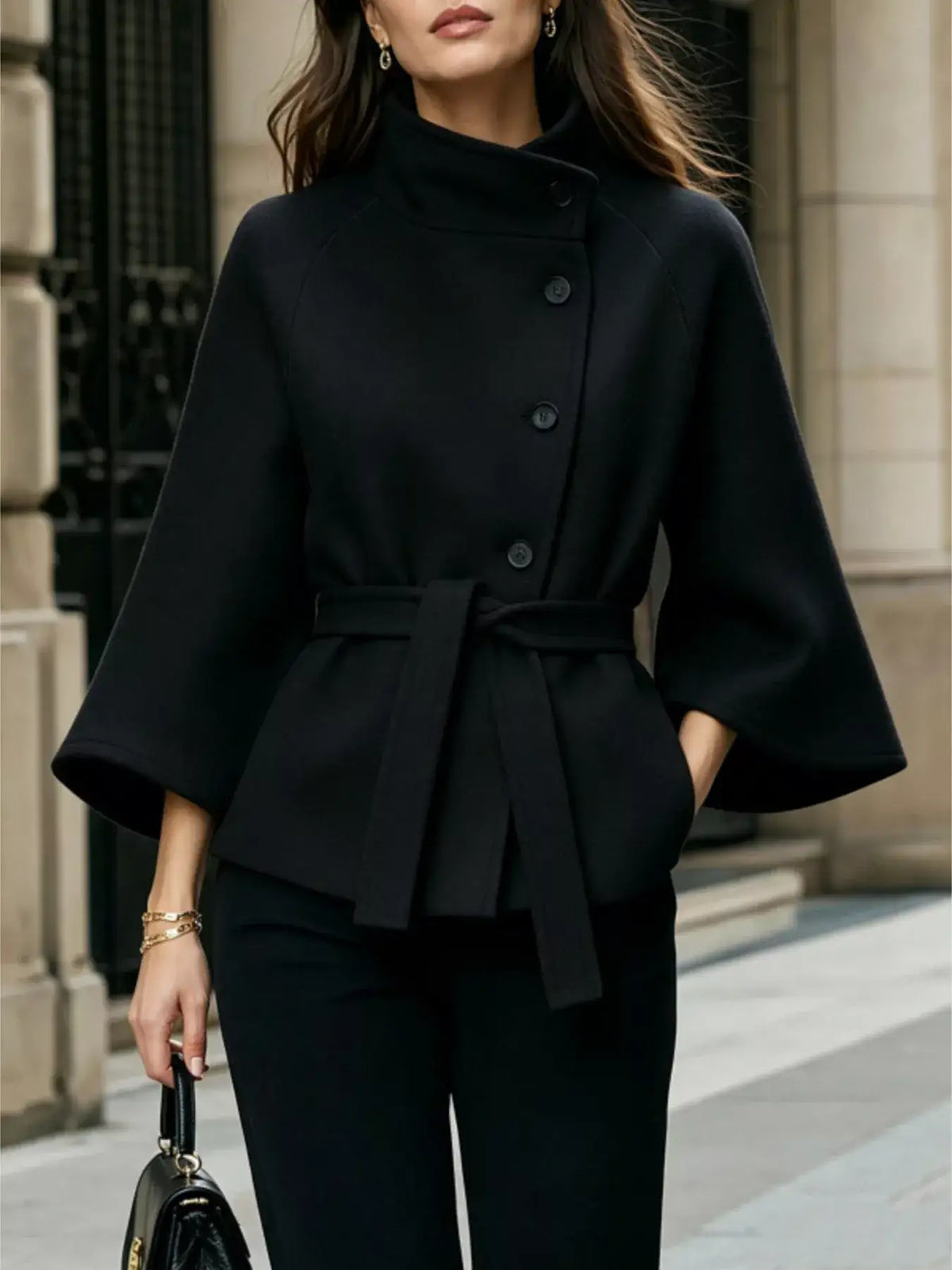 Evie's Dreamland black button-down cape coat with a high collar and belted waist for a tailored fit.