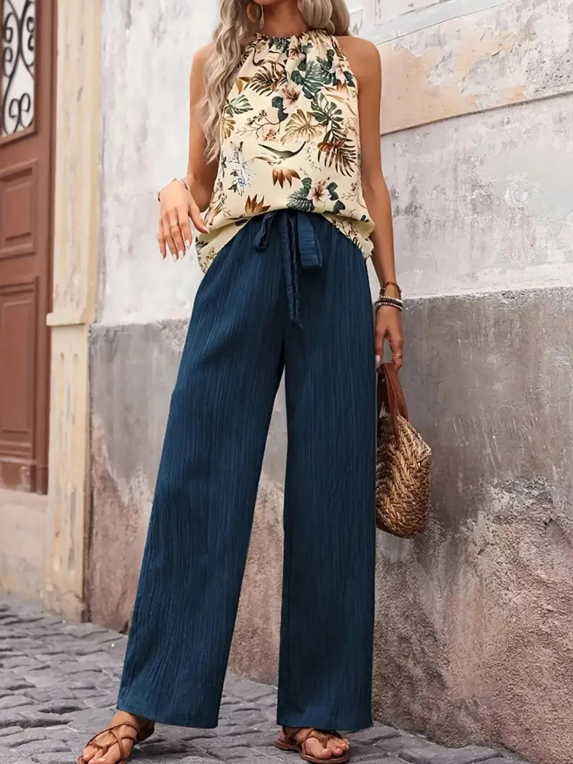Woman wearing a printed sleeveless tank and wide-leg pants set, summer style