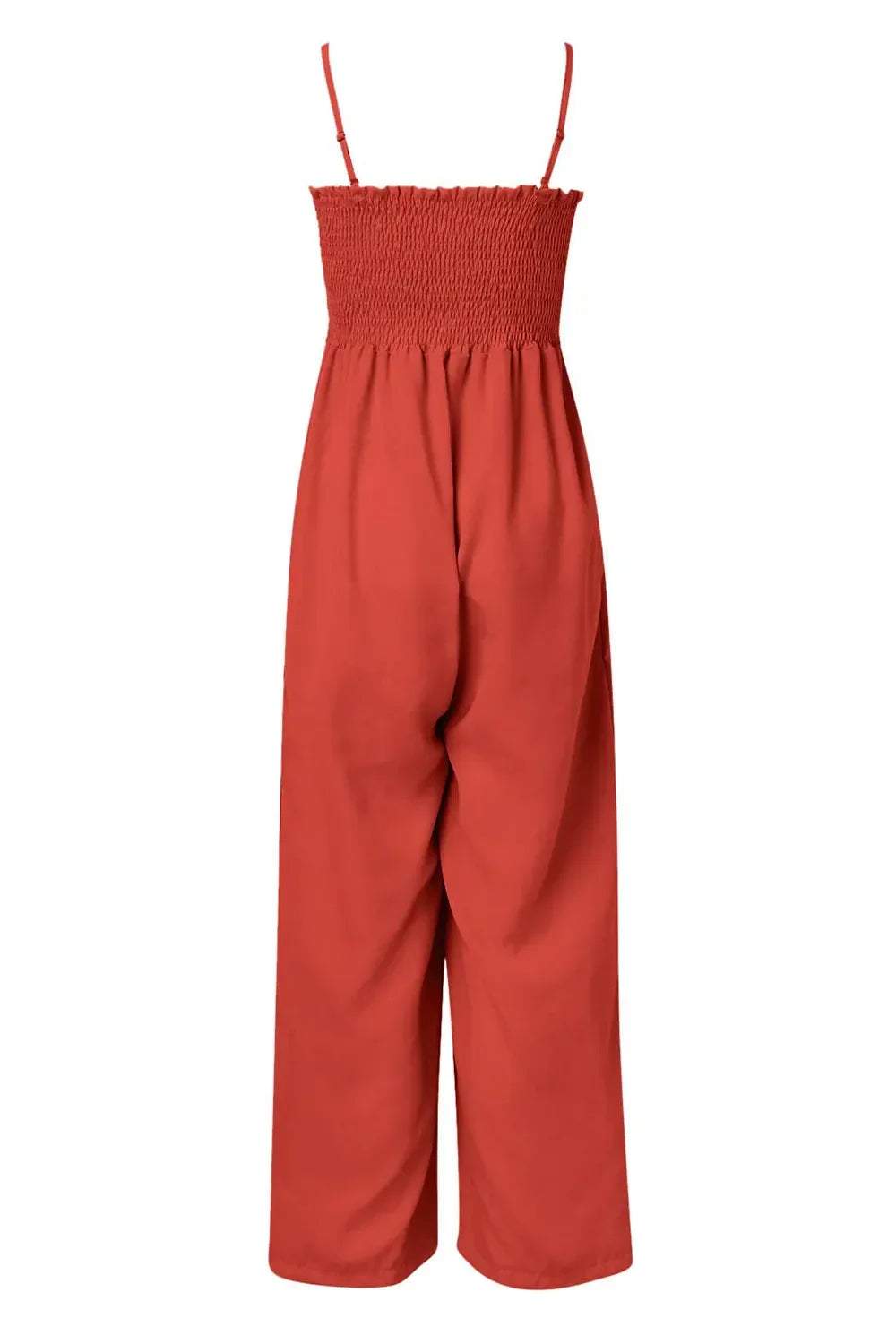 Rust red sleeveless jumpsuit with smocked bodice and wide-leg pants on white background