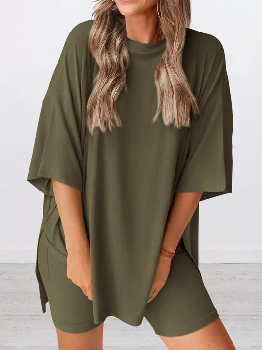 Woman wearing oversized olive green lounge tee and matching bike shorts set