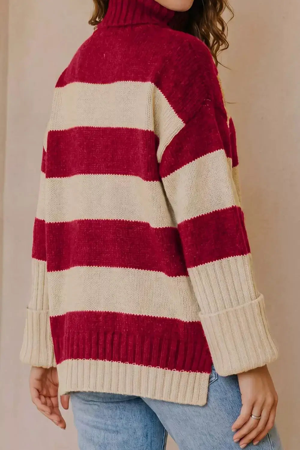 Evie's Dreamland red and beige striped turtleneck sweater with long sleeves and a relaxed fit.