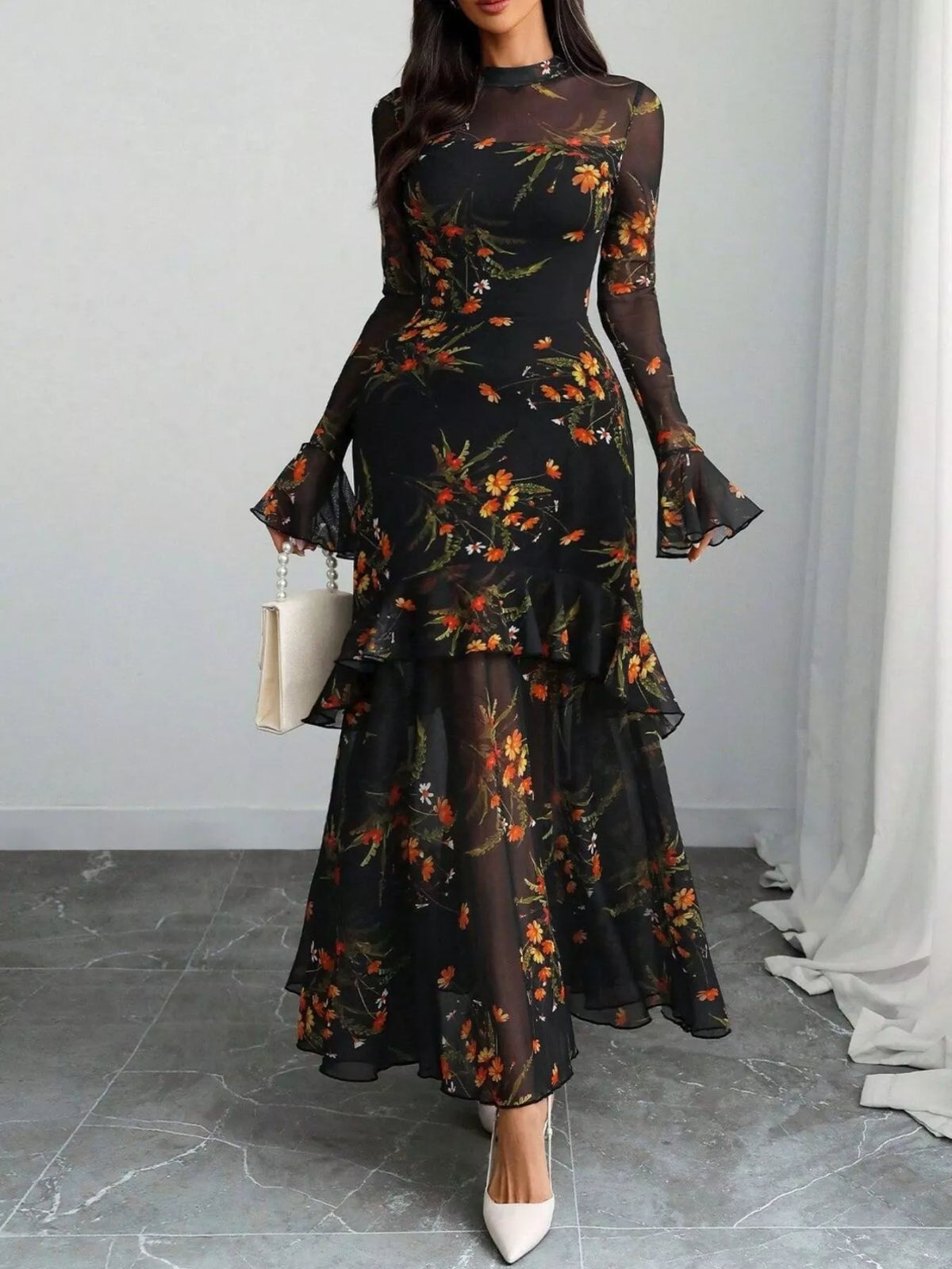 Evie's Dreamland black floral mermaid maxi dress with dramatic flounce sleeves