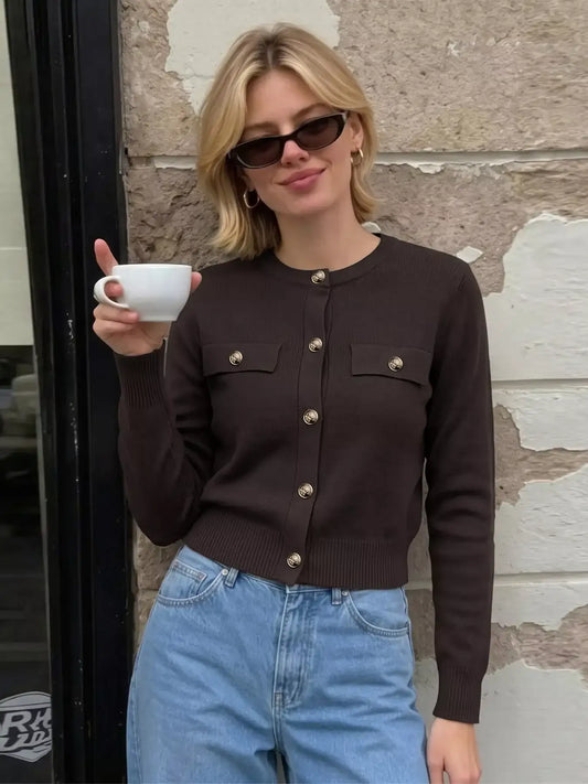 Woman wearing a brown long sleeve knit button down cardigan with gold buttons from Evie's Dreamland.
