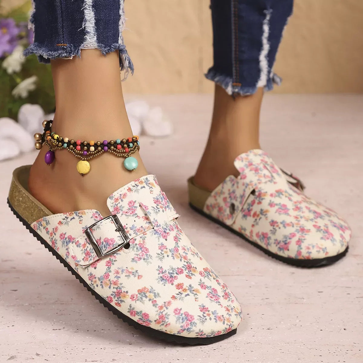 Close-up of buckle detail on floral print flat shoe