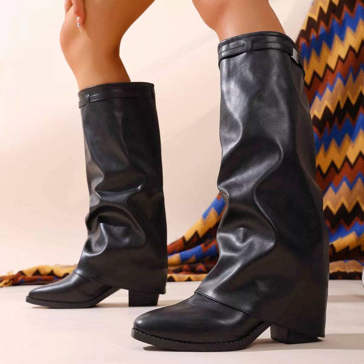 Women's black slouchy leather boots with a block heel and strap detail