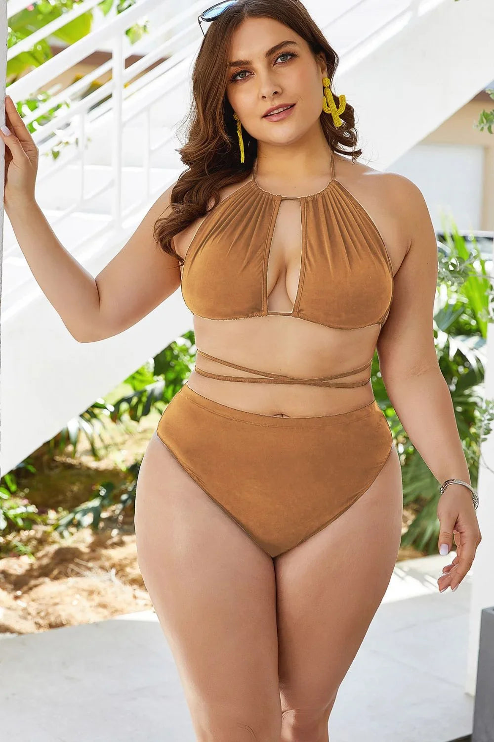 Front view of the plus size cutout tied backless halter bikini set — women's two-piece swimsuit in a solid color.