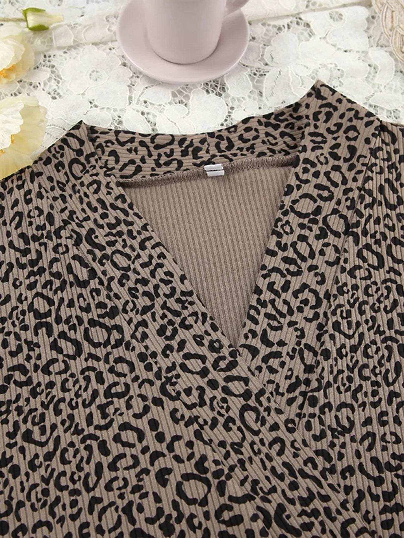 Brown ribbed fabric top with black leopard print pattern on lace background with flowers and cup