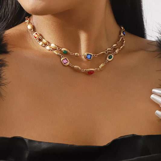 Gold double-layer choker necklace with colorful square and oval gemstones, perfect for elegant everyday wear.