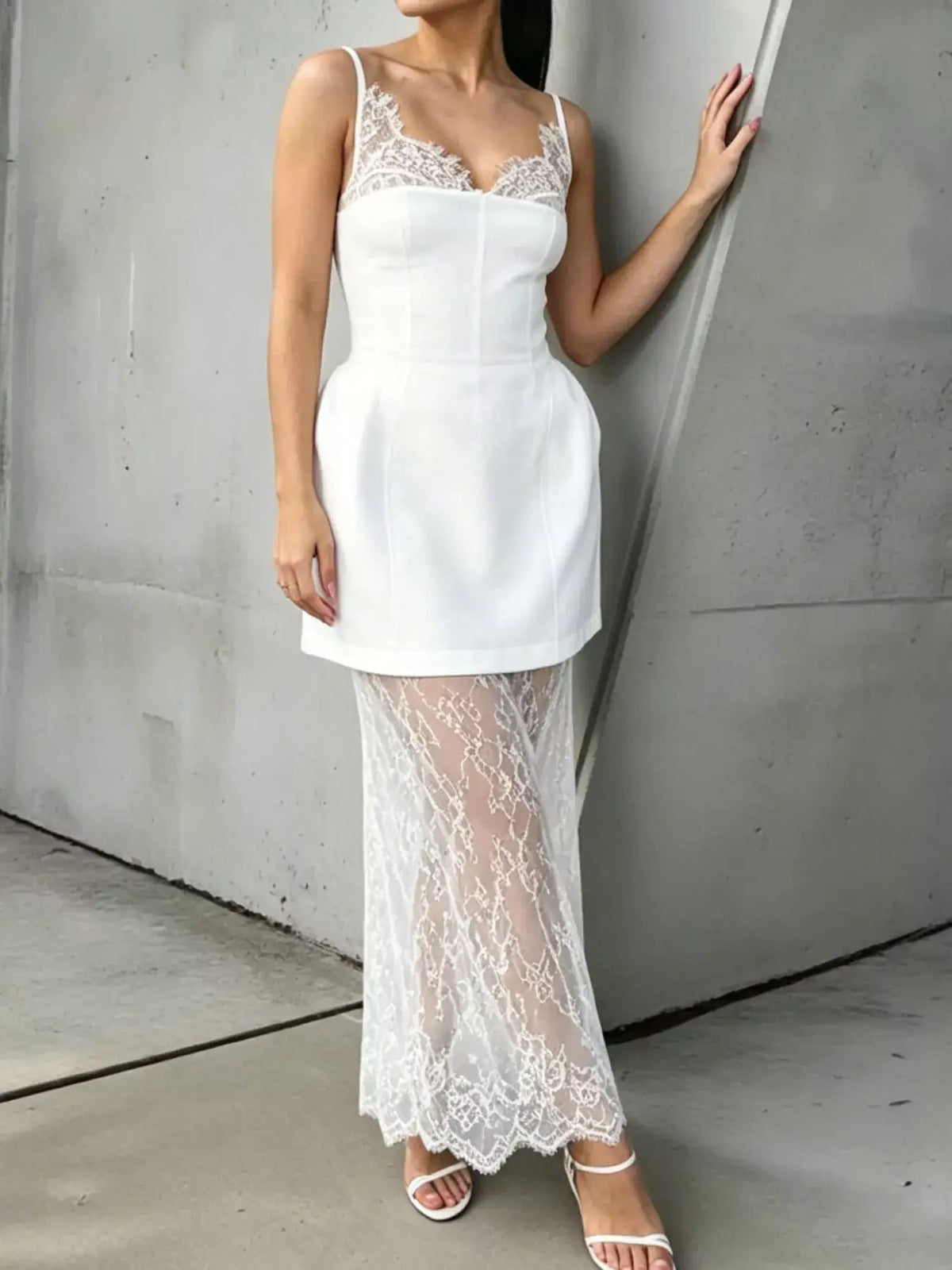 Evie's Dreamland white lace corset mini dress with a matching sheer lace overlay skirt.