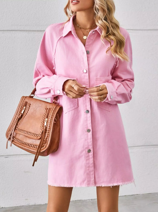 Woman wearing a pink button-down shirt dress with a brown handbag, casual fashion style