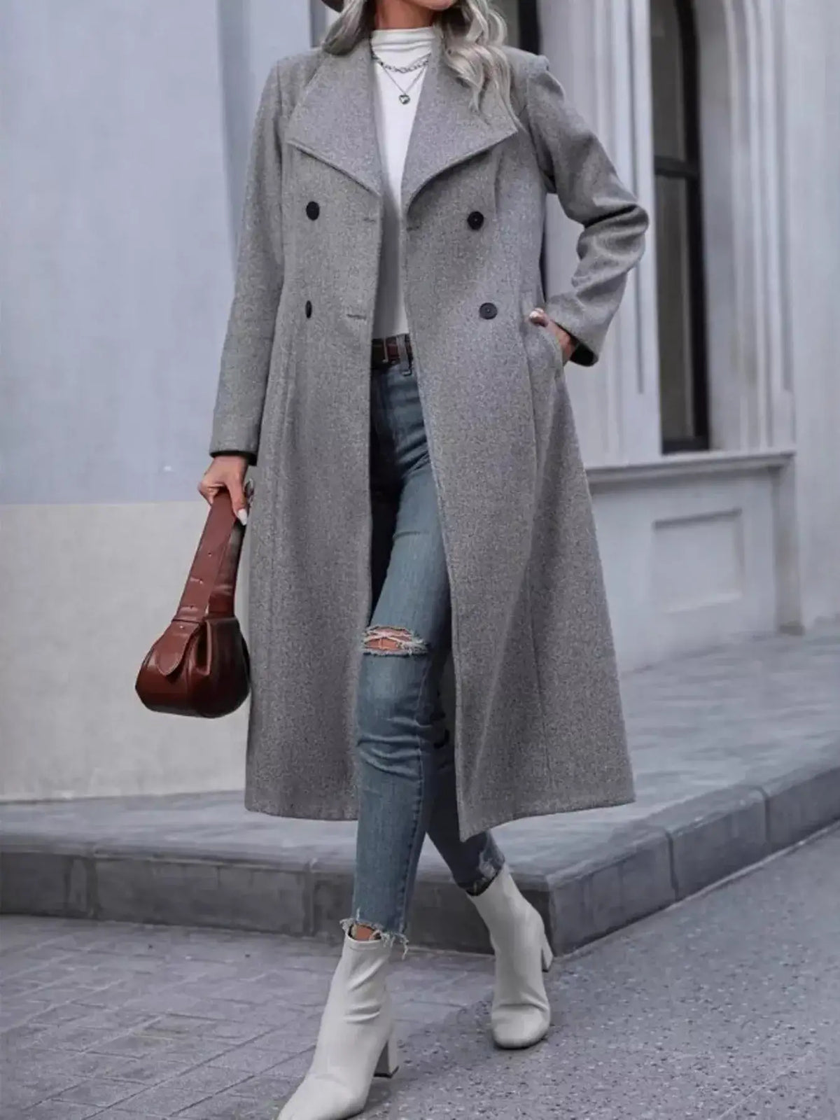 Long women's coat styled with a chic seasonal outfit
