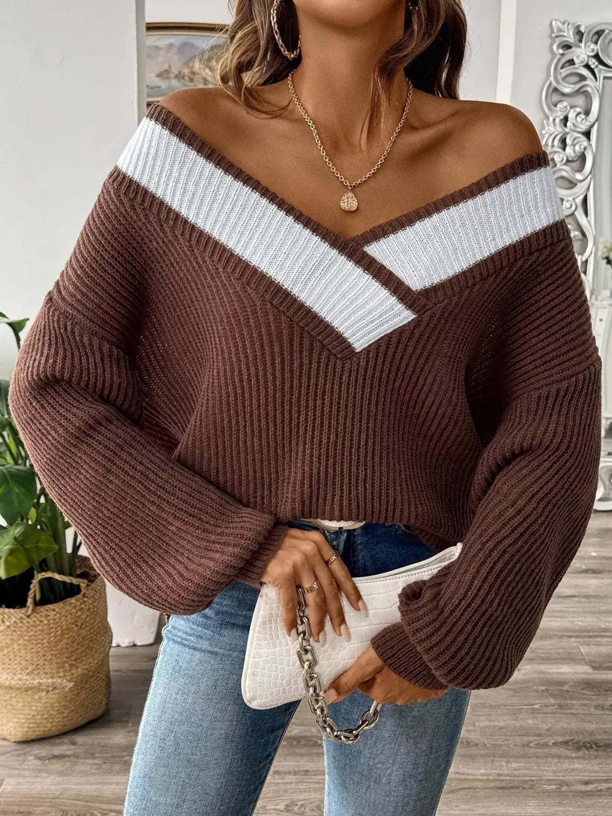 Women's ribbed sweater featuring a V-neckline and contrast trim
