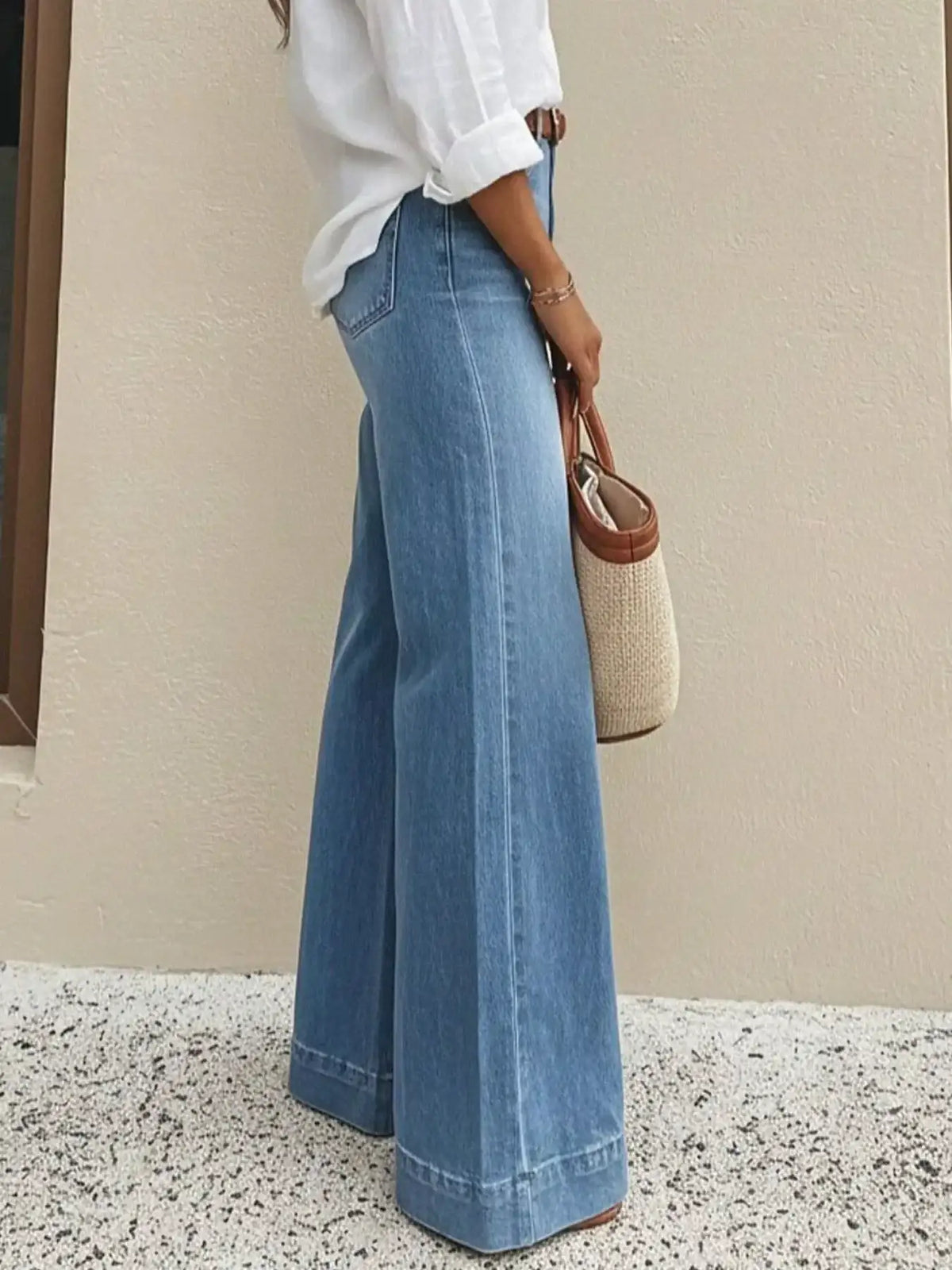 Full-length women's distressed straight-leg jeans in denim blue
