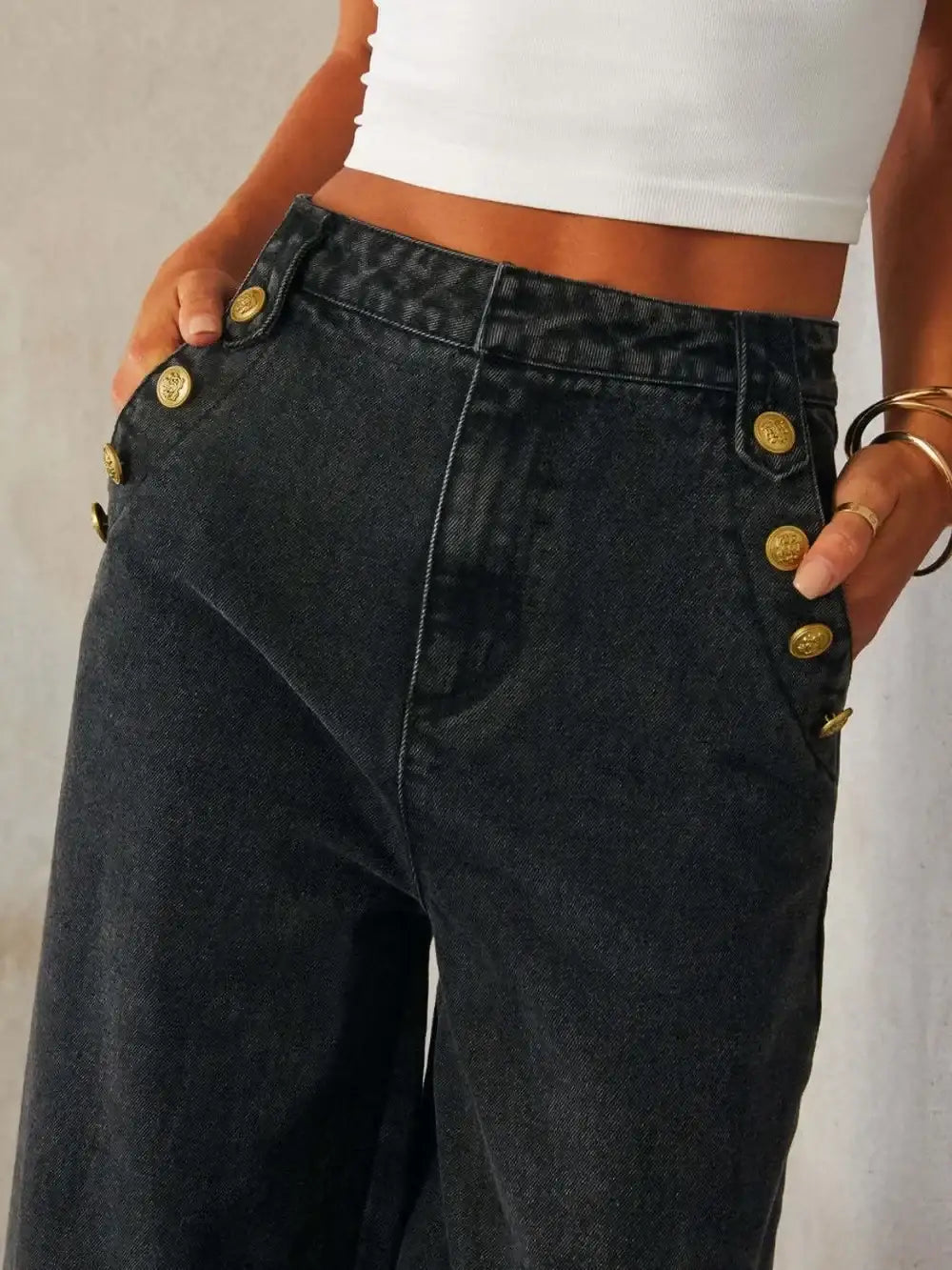 Women's high-rise wide-leg jeans in dark wash with button detail